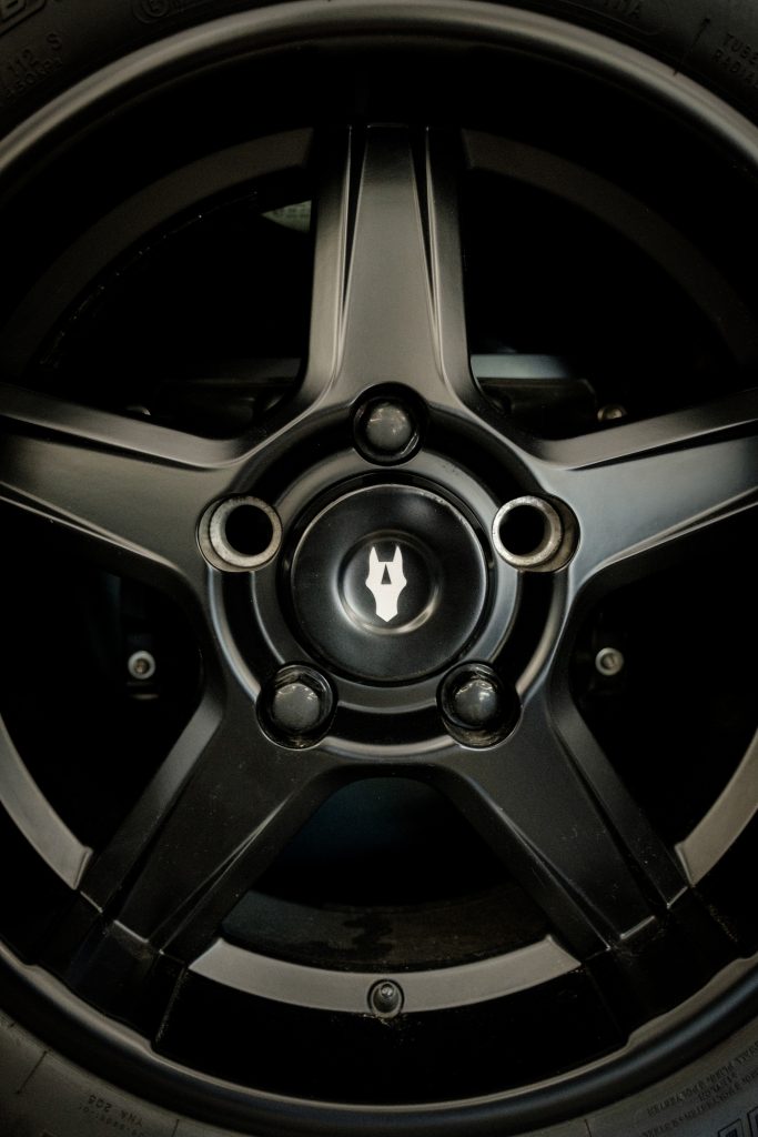 Black alloy wheel with the Autelier crest centre cap