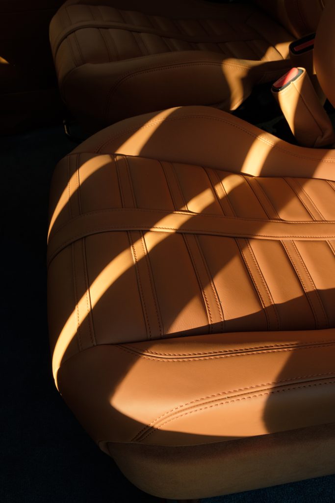 Hand-stitched tan leather Defender seat