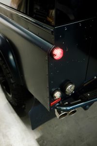 Round rear light cluster and twin exhaust tips at the rear corner