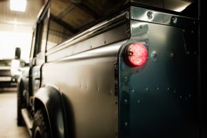 Rear three-quarter view of the Defender LS in the workshop